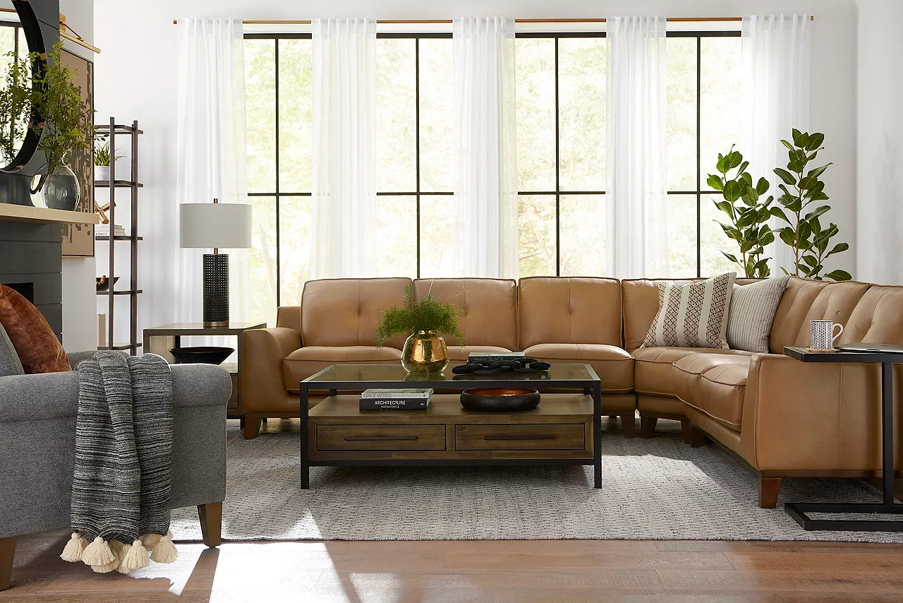 Phoenix sectional in room scene with Archer occasional tables and Alaina accent chair
